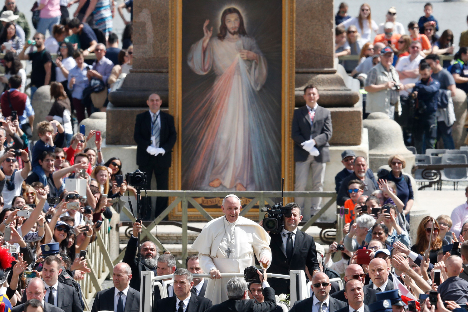 Pope Francis greets the crowd after celebrating Mass marking the feast of Divine Mercy in St. Peter’s Square at the Vatican April 8.